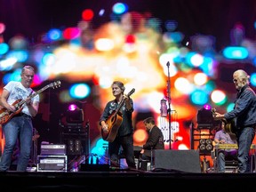 Colin Cripps (L), Jim Cuddy (C) and Greg Keelor (R) of Blue Rodeo on the City Stage as the RBC Bluesfest continues on the grounds of the Canadian War Museum at Lebreton Flats.