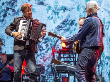 Jim Cuddy (L) Mike Boguski, (C) and Greg Keelor (R) of Blue Rodeo on the City Stage as the RBC Bluesfest continues on the grounds of the Canadian War Museum at Lebreton Flats. Photo by Wayne Cuddington/ Postmedia