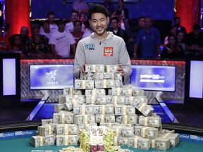 John Cynn poses for photographers after winning the World Series of Poker main event, Sunday, July 15, 2018, in Las Vegas.