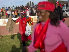 A supporter of leading opposition challenger Nelson Chamisa cheers during a campaign rally in Bulawayo, Zimbabwe, Saturday July 21, 2018. Just 3 percentage points now separate Chamisa and former Mugabe deputy and current President Emmerson Mnangagwa ahead of the July 30 presidential vote, according to a new survey by the Afrobarometer research group.