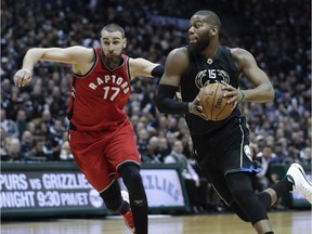 Greg Monroe, then with the Milwaukee Bucks, drives to the basket against Raptors centre Jonas Valanciunas during a game in April 2017. Now the two will be teammates.