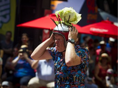 Mike Wood's outdoor stunt comedy show at Buskerfest on Saturday, Aug. 4, 2018 included catching a catapulted cabbage on a spike on his head.