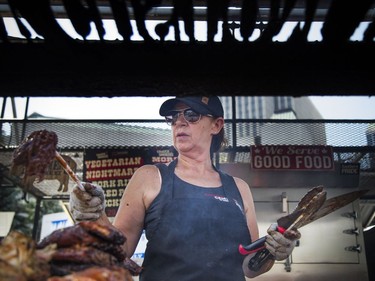 The smells of barbecue sauces wafted through the air in Festival Plaza at Ottawa City Hall during Capital Ribfest on Saturday, Aug. 4, 2018. Heather Brynaert was cooking up the meat at Crazy Canucks Smokers.