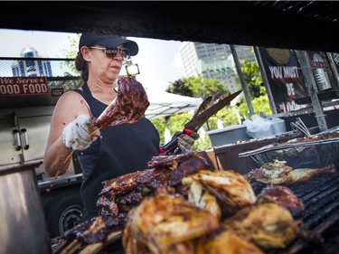 The smells of barbecue sauces wafted through the air in Festival Plaza at Ottawa City Hall during Capital Ribfest on Saturday, Aug. 4, 2018. Heather Brynaert was cooking up the meat at Crazy Canucks Smokers.