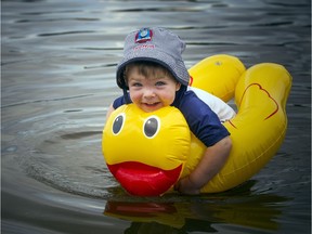 Two-year-old Grayson Roberts found a way to beat the heat on Saturday, Aug. 4, 2018, taking his rubber ducky floaty for a spin in the Rideau River at Mooney's Bay.