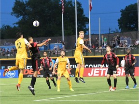 Tucker Hume (12) of Nashville SC and Onua Obasi of Fury FC both attempt to head a high ball during the first half of Friday's match. Nashville SC photo.