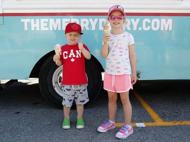 Bennett, 3, and Abigail, 5, eat ice cream at the West End Food Truck Rally in Ottawa on Saturday, Aug. 11, 2018.