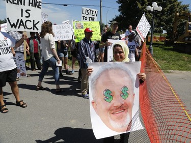 Members of the Hamilton Tenants Solidarity Network and the Herongate Tenant Coalition protest near the home of CLV Group CEO Mike McGahan in Manotick on Saturday, Aug. 11, 2018.