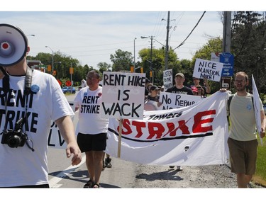 Members of the Hamilton Tenants Solidarity Network and the Herongate Tenant Coalition protest near the home of CLV Group CEO Mike McGahan in Manotick on Saturday, Aug. 11, 2018.