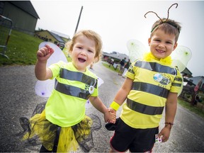 Two-year-old Suzy Sikorski and four-year-old brother Freddy Sikorski made their own bee costumes for World Honeybee Day at the Ag Museum Saturday.