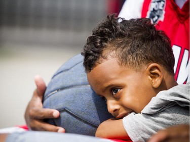 The annual Hoopstar Classic took place on Saturday August 18, 2018 at St. Luke's Park near Elgin Street and Gladstone Avenue. four-year-old Adel Gaas snuggles up beside one of the players holding a basketball as the game kicked off Saturday.
