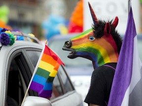 Capital Pride's 2016 parade brought thousands out to show support for Ottawa's LGBTTQ despite the wet weather August 21, 2016.   Ashley Fraser/Postmedia