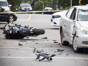 A 57-year-old motorcyclist is dead following a collision with a car Saturday afternoon near the intersection of Hazeldean Road and Carbrooke Street in Kanata.  Ashley Fraser/Postmedia