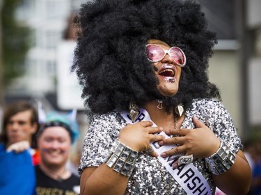 The Capital Pride Parade filled the streets with over 130 groups including community groups, sports teams, embassies and local businesses  along with thousands of spectators Sunday August 26, 2018. Parade marshal China Doll, a popular Ottawa celebrity.   Ashley Fraser/Postmedia