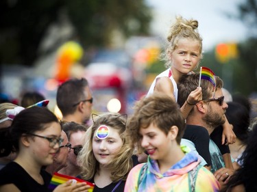 The Capital Pride Parade filled the streets with over 130 groups including community groups, sports teams, embassies and local businesses  along with thousands of spectators Sunday August 26, 2018. Seven-year-old Béatrice Bergevin had a great viewing point of the parade from up on her dads shoulders.   Ashley Fraser/Postmedia