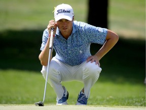 Justin Thomas lines up a putt on the fifth green during the third round of the World Golf Championships-Bridgestone Invitational on Saturday.