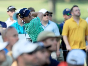 Justin Thomas plays his shot from the 11th tee during Sunday's closing round of the World Golf Championships-Bridgestone Invitational at Firestone Country Club in Akron, Ohio.