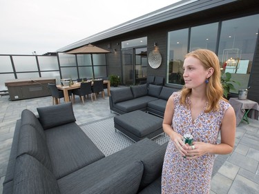 Helping out hosting is Mary Kelly on the terrace of the luxury condo for sale at  Yard & Station at 12 Stirling Ave. in Hintonburgh