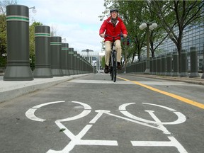 Cyclists try out the track in front of the American Embassy and beside the Château Laurier, in this file photo.