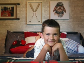Mom and designer Kristi Blok created an accent wall in her nine-year-old son Jameson's bedroom out of peel and stick wallpaper that looks like whitewashed brick.