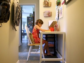 Mom and designer Kristi Blok created a study space for her kids in a hallway nook between their family room and kitchen as part of a blogger's challenge to repurpose a space for $100.