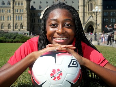 Maya Antoine of the Canadian women's soccer team poses with a soccer ball at Parliament Hill on Thursday.  Julie Oliver/Postmedia