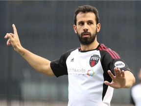 Midfielder Cristian Portilla of Ottawa Fury FC signals to teammates during a United Soccer League match against the Pittsburgh Riverhounds at Pittsburgh on Saturday, April 14, 2018.