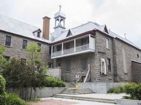 The vacant convent if the Sisters of the Visitation behind modern day residences at 114 Richmond Road in Ottawa.