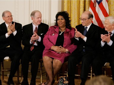 Singer Aretha Franklin (C) recieves applause from internet software designer Robert Kahn (L) historian Robert Conquest (2nd-L),  outgoing Federal Reserve Board Chairman Alan Greenspan (2nd-R) and actor Andy Griffith before recieving the Medal of Freedom from U.S. President George W. Bush during a ceremony at the White House November 9, 2005 in Washington DC. President Bush presented medals to the 2005 Medal of Freedom recipients during a ceremony in the East Room.