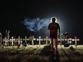 Twenty-six crosses stand in a field on the edge of town to honour the 26 victims killed at the First Baptist Church of Sutherland Springs on November 6, 2017 in Sutherland Springs, Texas.