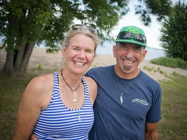 Louise Hine-Schmidt and her husband Brent Schmidt after completing the 13km stand up paddle board race Saturday. Louise was the first place female in the race and her husband, the first place for the men.