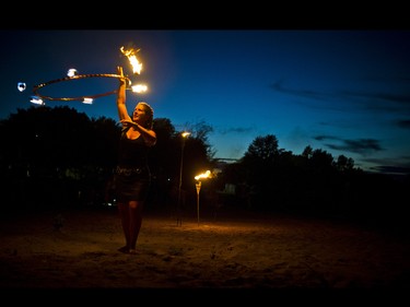 Fire performer Jamie Martin performed Friday night on the beach at Riverside Park in Pembroke.