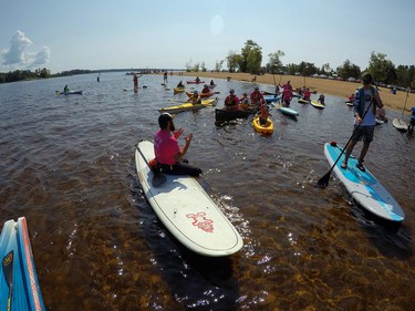 The crew of paddlers gathered together to get the rundown for the two routes for the Paddle for CHEO charity paddle.