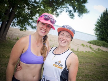 Stand up paddle board racers Louise Hamelin and Jamie Lee Moir, who were all smiles after finishing the 13km race.