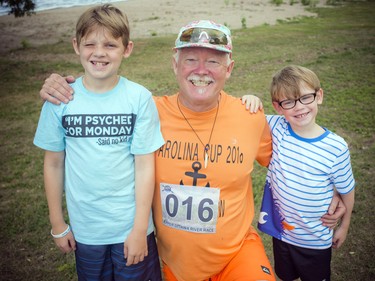 11-year-old Jacob Della Palme, Darryll Luesby and six-year-old Luca Della Palme Saturday afternoon after the paddle board races.