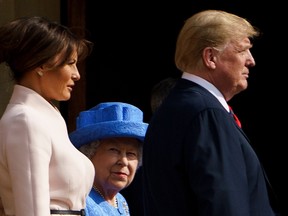 Britain's Queen Elizabeth II escorts US President Donald Trump and US First Lady Melania Trump into Windsor Castle in Windsor, west of London, on July 13, 2018 on the second day of Trump's UK visit.
