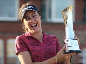 Georgia Hall poses with the trophy after winning the 2018 Women's British Open Golf Championships at Royal Lytham and St Annes Golf Club on Sunday.