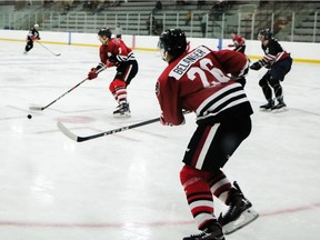 Alec Belanger (26) passes the puck to Sasha Chmelevski during a 67's intrasquad game on Wednesday. Jacob Kelly/Ottawa 67's photo