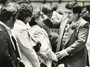 Ernest Angely making his way amongst line-ups waiting to meet him or to be healded by him