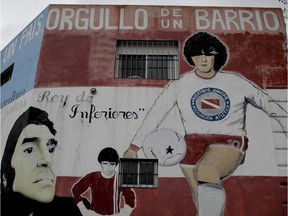 A house with a mural of soccer great Diego Maradona stands in front of Argentino Juniors' stadium "Diego A. Maradona" in Buenos Aires on Friday. Argentinos Juniors' stadium will change its name to "Autocredit Diego A. Maradona," the first time that an Argentine Club includes a sponsor in the name of its stadium.