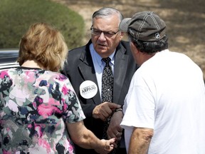 U.S. Senate candidate and former Maricopa County Sheriff Joe Arpaio speaks with voters at a campaign stop Thursday, Aug. 23, 2018, in Scottsdale, Ariz. Arpaio's Senate run will likely be the former sheriff's last political act, as he is expected to finish well outside the running in the GOP Senate primary.