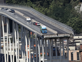 Abandoned vehicles on the Morandi bridge the day after a section collapsed in Genoa, Italy, Aug. 15, 2018.