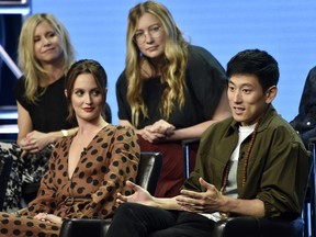 Jake Choi, right, a cast member in the Disney ABC television series "Single Parents," answers a question as fellow cast member Leighton Meester, front left, and co-creators/executive producers JJ Philbin, top left, and Elizabeth Meriwether look on during the 2018 Television Critics Association Summer Press Tour, Tuesday, Aug. 7, 2018, in Beverly Hills, Calif.