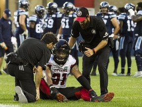 Ottawa Redblacks linebacker Kevin Brown II (31) receives medical attention during second quarter CFL action in Toronto on Thursday, August, 2, 2018.