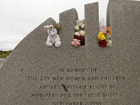 Stuffed animals and flowers mark the Swissair memorial at Whalesback near Peggy's Cove, N.S. on Monday, Sept. 1, 2008.