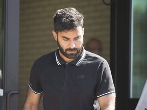 Truck driver Jaskirat Sidhu walks out of provincial court after appearing for charges due to the Humboldt Broncos bus crash in Melfort, Sask., on Tuesday, July 10, 2018. The case of a Calgary truck driver charged in the Humboldt Broncos bus crash has been adjourned until October.