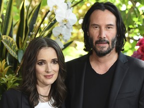 Winona Ryder and Keanu Reeves attend the "Destination Wedding" photo call on Saturday, Aug. 18, 2018, in Los Angeles. (Photo by Jordan Strauss/Invision/AP) ORG XMIT: CANS6116