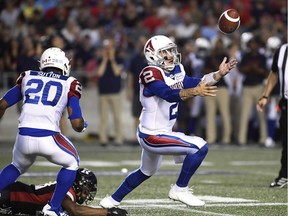 Montreal Alouettes quarterback Johnny Manziel (2) loses control of the ball under pressure from Ottawa Redblacks' Corey Tindal (28) during first half CFL action in Ottawa on Saturday, Aug. 11, 2018.