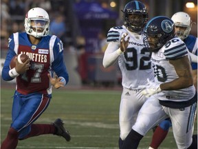 Alouettes quarterback Antonio Pipkin carries the ball during the first half of Friday's CFL against the Argonauts in Montreal.