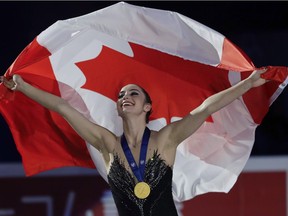 Kaetlyn Osmond celebrates after winning the women's free skating program, at the Figure Skating World Championships in Assago, Italy, on March 23.